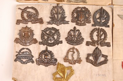 Lot 2217 - A collection of cap badges, lapel badges and...