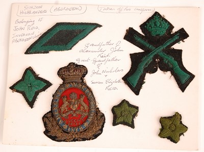 Lot 2219 - A collection of shoulder titles, collar badges...