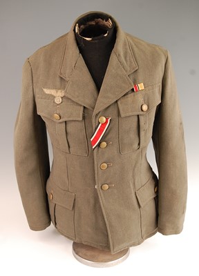 Lot 2458 - A German Army tunic, in green having four...