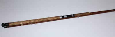 Lot 2621 - An unmarked fibreglass 9' two piece spinning rod.