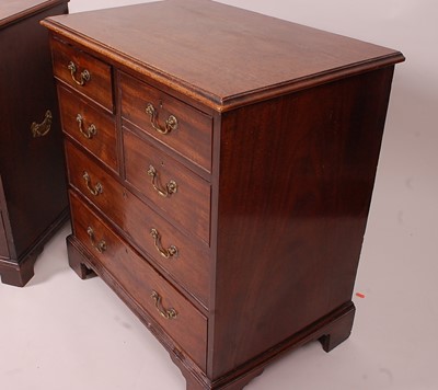Lot 3366 - A matched pair of George III mahogany chests,...