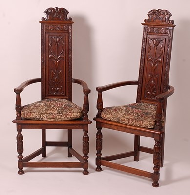 Lot 3367 - A pair of medieval style oak elbow chairs,...