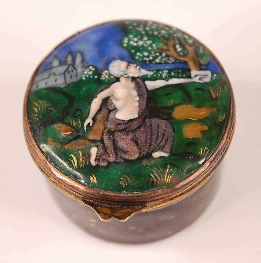 Lot 3173 - A gilt and enamel decorated circular pill box,...