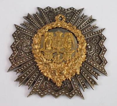 Lot 2467 - A helmet plate the gilt centre with a crowned...