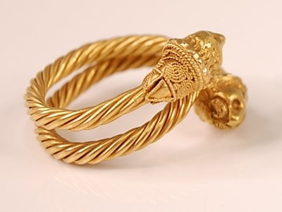 Lot 3114 - A yellow metal Etruscan style twisted...