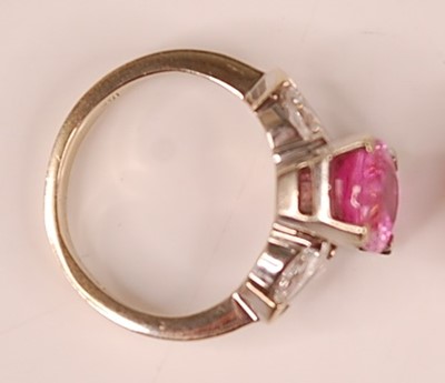 Lot 3108 - A white metal, pink sapphire and diamond three...