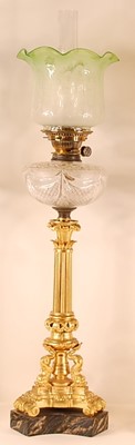Lot 3206 - A gilt bronze pedestal oil lamp, having a...