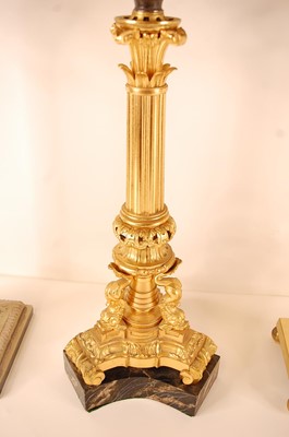 Lot 3206 - A gilt bronze pedestal oil lamp, having a...