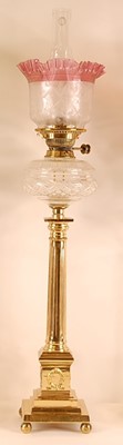 Lot 3207 - A lacquered brass pedestal oil lamp, having a...