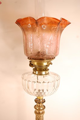 Lot 3208 - A late Victorian pedestal oil lamp, having a...