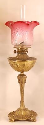 Lot 3211 - An Art Nouveau gilt metal pedestal oil lamp,...
