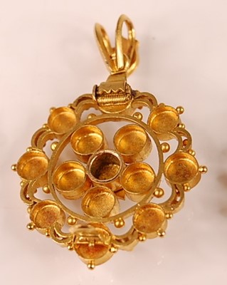 Lot 3112 - A yellow metal openwork oval cluster pendant,...