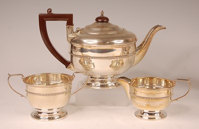 Lot 3077 - A George V silver three-piece tea set,...