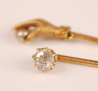 Lot 3121 - A yellow metal and diamond set stick pin, the...