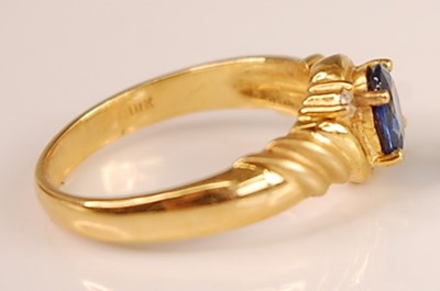 Lot 3092 - An 18ct gold Ceylon sapphire and diamond set...