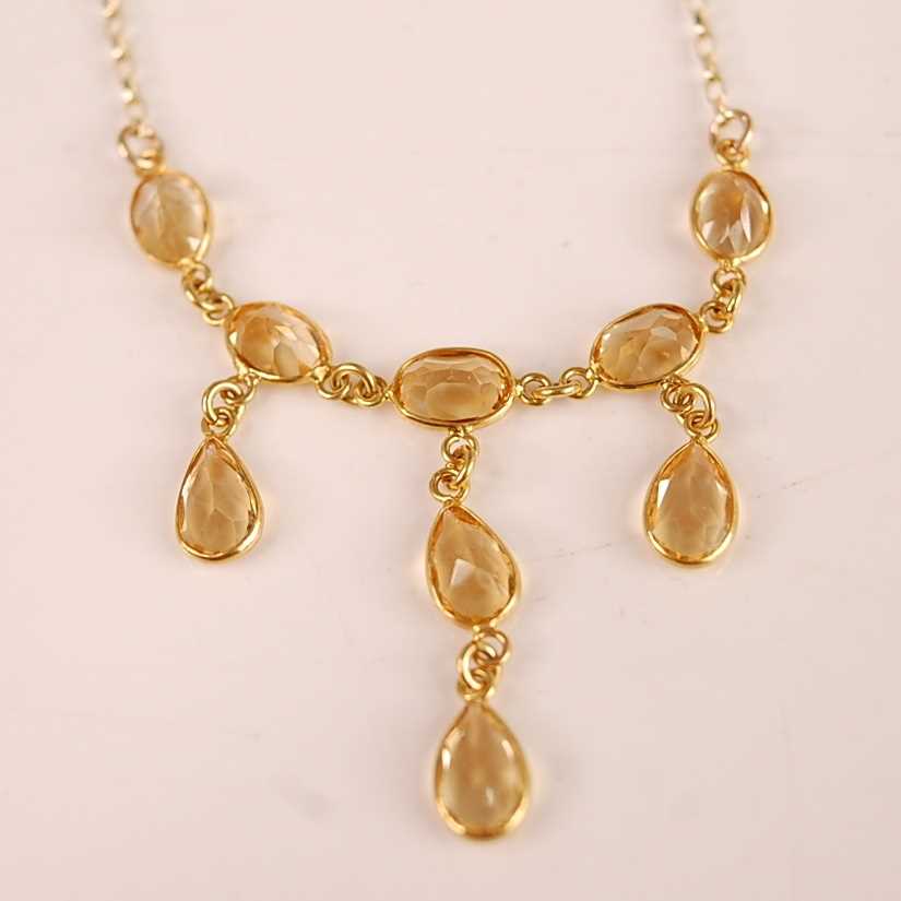 Lot 3118 - A contemporary 9ct gold citrine set necklet,...