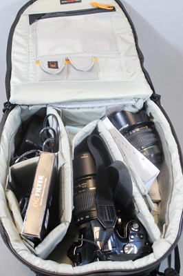 Lot 607 - A Pentax K-X digital SLR camera, together with...