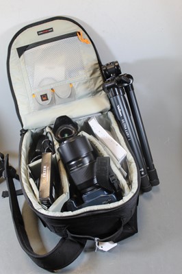Lot 607 - A Pentax K-X digital SLR camera, together with...