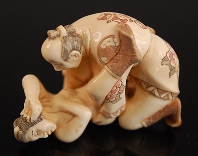 Lot 243 - * A Japanese bone netsuke, carved as a male...