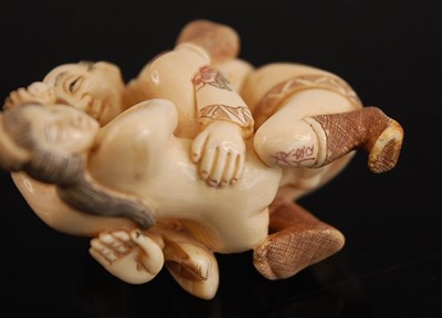 Lot 243 - * A Japanese bone netsuke, carved as a male...