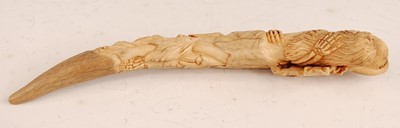 Lot 51 - * A cow bone? model of a tusk, carved as a...