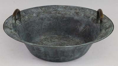 Lot 249 - * A Chinese copper alloy twin handled basin,...