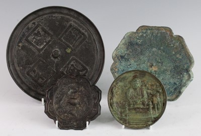 Lot 255 - * A Chinese cast bronze hand mirror, of...