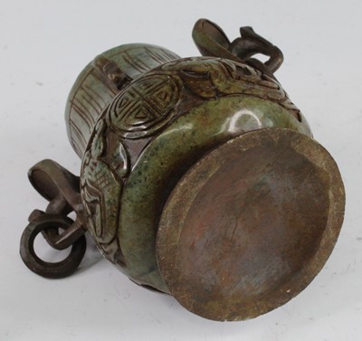Lot 258 - * A Chinese carved jadeite covered jar and...