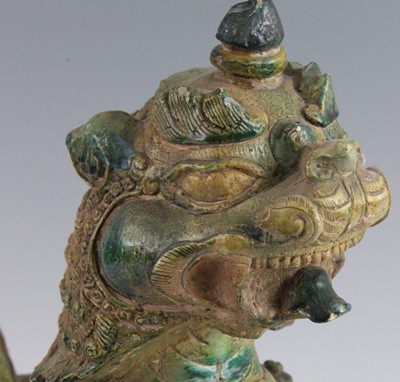 Lot 270 - A Chinese green glazed pottery figure of a Fu...
