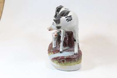Lot 4 - A 19th century Staffordshire model of a cow...