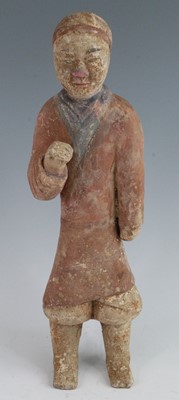 Lot 274 - * A Chinese polychrome painted pottery figure,...