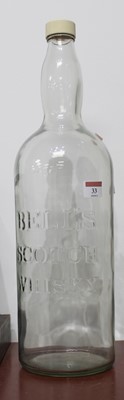 Lot 33 - An oversized glass Bell's Scotch Whisky bottle,...