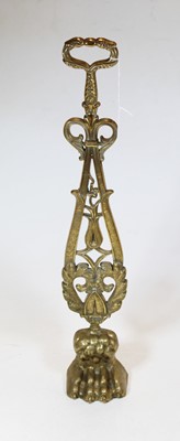 Lot 47 - A 19th century brass door-stop in the form of...