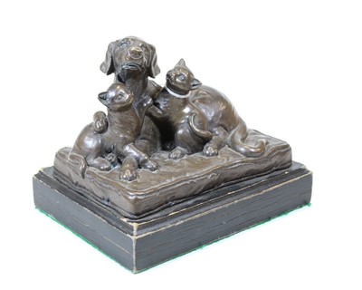 Lot 61 - A bronze model of a recumbent dog and two cats,...
