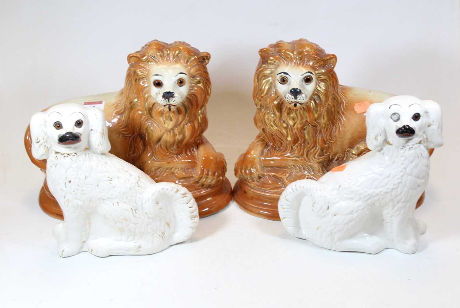 Lot 62 - A pair of Staffordshire pottery spaniels,...