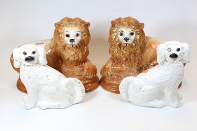 Lot 62 - A pair of Staffordshire pottery spaniels,...