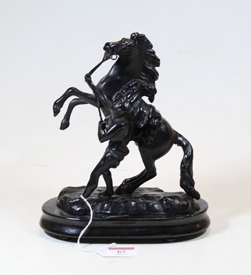 Lot 67 - A black painted spelter model of a Marly Horse,...