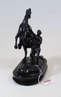 Lot 67 - A black painted spelter model of a Marly Horse,...