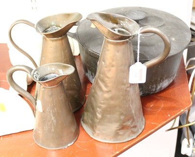 Lot 84 - A set of three Victorian graduated copper jugs,...