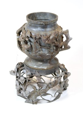 Lot 173 - A Chinese bronze vase, the twin handles in the...
