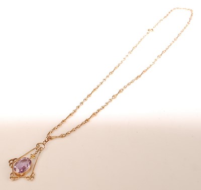Lot 2501 - A yellow metal amethyst pendant, attached to a...