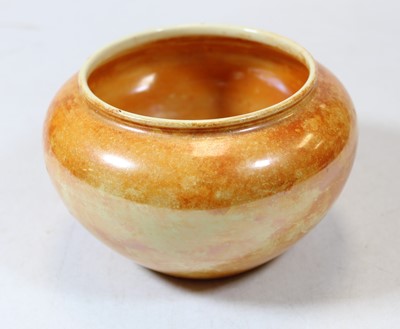 Lot 262 - A Ruskin pottery orange glazed bowl of squat...