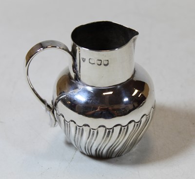 Lot 291 - A Victorian silver cream jug, the base of...