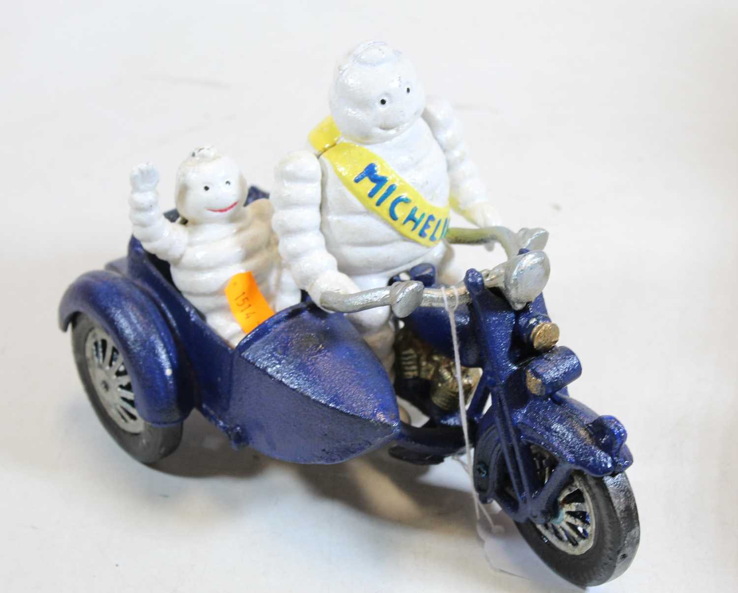 Lot 631 - A cast iron MIchelin man advertising figure on...