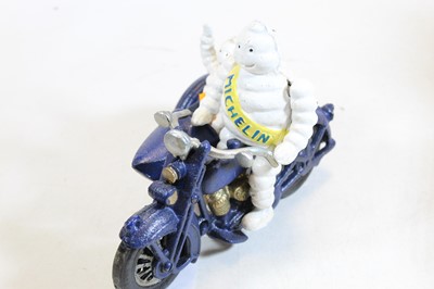 Lot 631 - A cast iron MIchelin man advertising figure on...