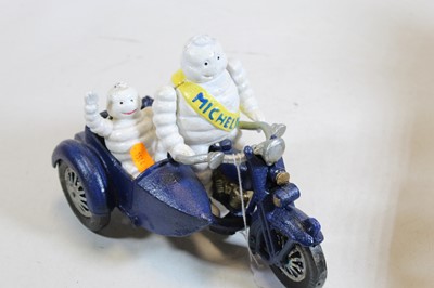 Lot 631 - A cast iron MIchelin man advertising figure on...