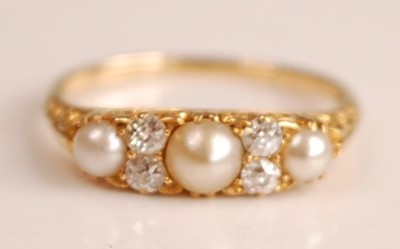 Lot 1095 - A yellow metal, pearl and diamond seven-stone...