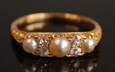 Lot 1095 - A yellow metal, pearl and diamond seven-stone...