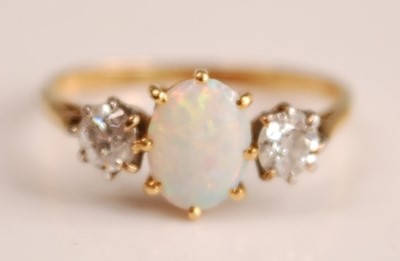 Lot 1094 - A yellow and white metal, opal and diamond...