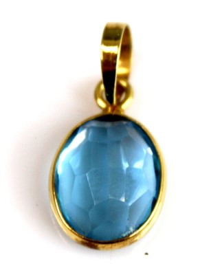 Lot 2512 - A yellow metal oval blue topaz pendant, the...